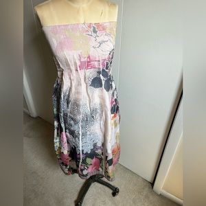 Strapless bathing suit type cover up. Very pretty with stretchy top